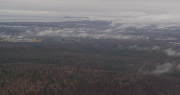 Aerial footage across snowy Alaskan mountaintops, drone helicopter footage