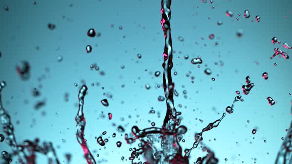 Super Slow Motion Shot of Water Splash at 1000Fps on Blue Gradient Background