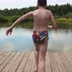 Boy Jumping Into the Lake From the Pier - VideoHive Item for Sale