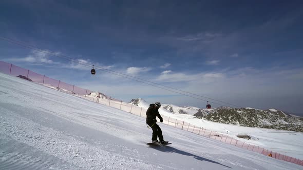 Young Man Snowboarder Follow Shot