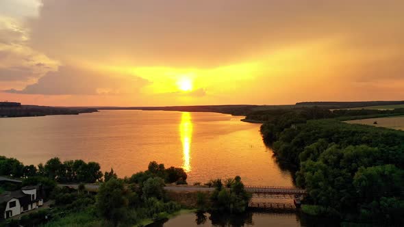 Amazing view of golden path over the river at sunset