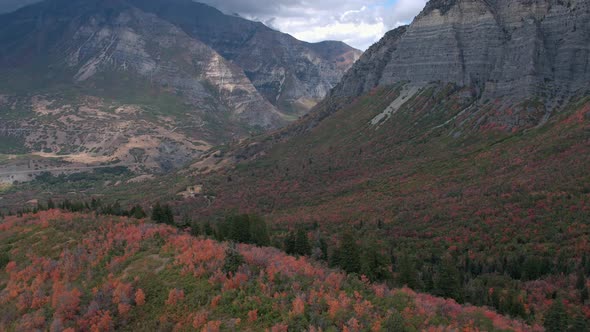 Aerial view moving down towards colorful hill side