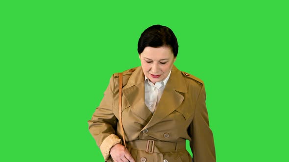 Thick Brunette Woman in a Trench Coat Walking on a Green Screen Chroma Key