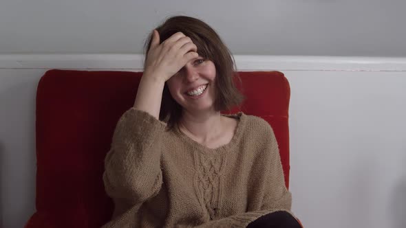 Woman sitting in chair smiling