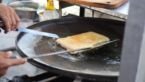 Making martabak telur. Indonesian street food.