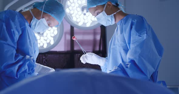 Medical professionals working at a hospital alt