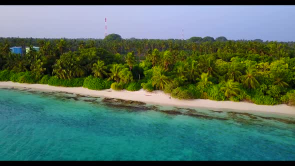 Aerial flying over seascape of paradise shore beach trip by shallow lagoon with white sand backgroun