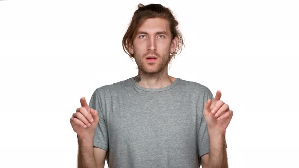 Portrait of European Displeased Man Showing Palms in Stop Gesture and Answering No Strictly Isolated