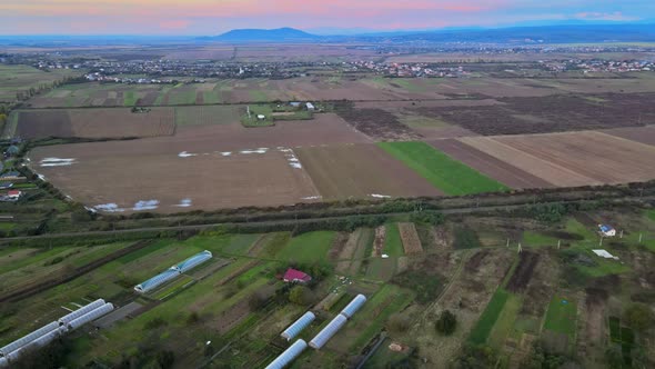 Aerial Top View of a Land with Down Green Fields in Countryside