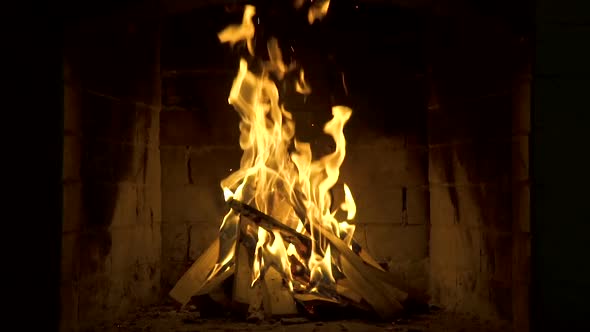 Burning Fire In The Fireplace. Slow Motion. A Looping Clip of a Fireplace 