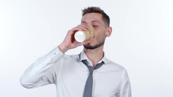 Exhausted Businessman Drinking Coffee