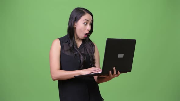 Young Beautiful Asian Businesswoman Using Laptop