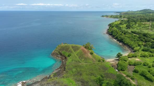 Aerial descend view tropical Blue lagoon beach, São Tomé Island