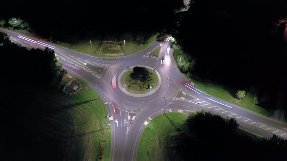 Time Lapse of a Roundabout at Night with Vehicles and Traffic