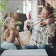 Mom Makes Music on the Violin and Her Daughter Gives Advice to a Woman - VideoHive Item for Sale