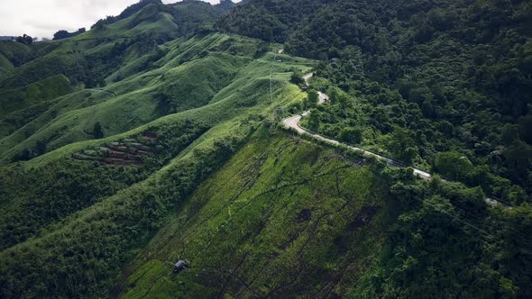 Countryside Road Passing Through The Mountain Landscape 