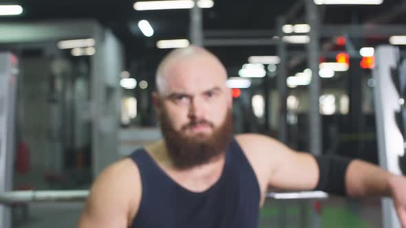 Powerlifter Posing in Underground Garage