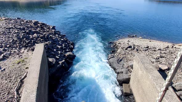 Closeup of water outlet from hydroelectric powerplant in Norway - Water has passed through turbine a