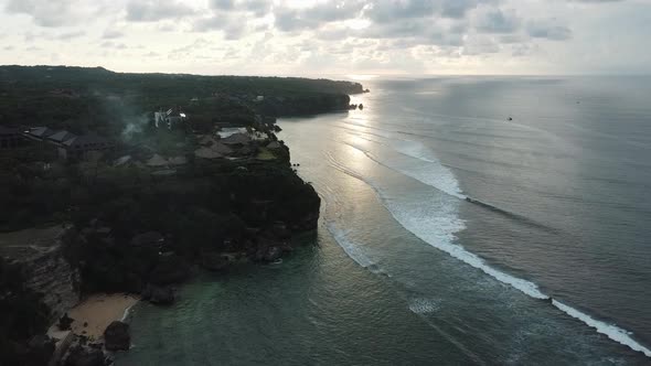 Beautiful Bingin beach with exotic cliffs houses and hotel located in Bali, Indonesia. This drone fo