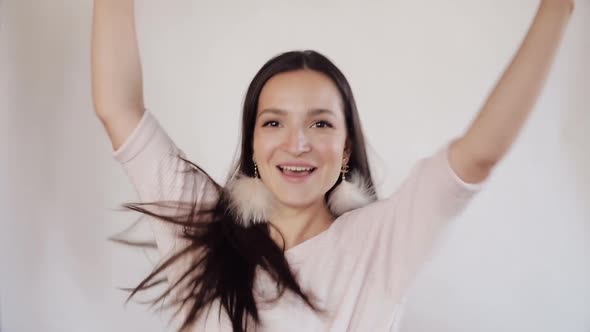 Gorgeous Brunette Lady with Star Earrings Dancing in Sunlight