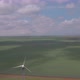 Aerial view of wind turbines energy production and road on fields - VideoHive Item for Sale