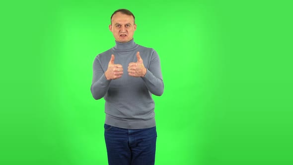 Male Is Showing Thumbs Up, Gesture Like. Green Screen