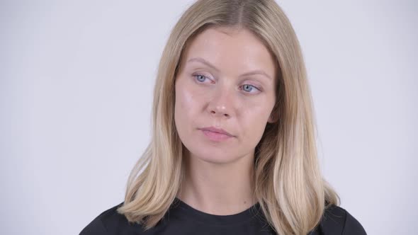 Face of Young Stressed Blonde Woman Looking Bored and Tired