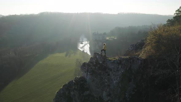 Aerial view of a woman on the rocks, Dinant, Namur, Belgium.