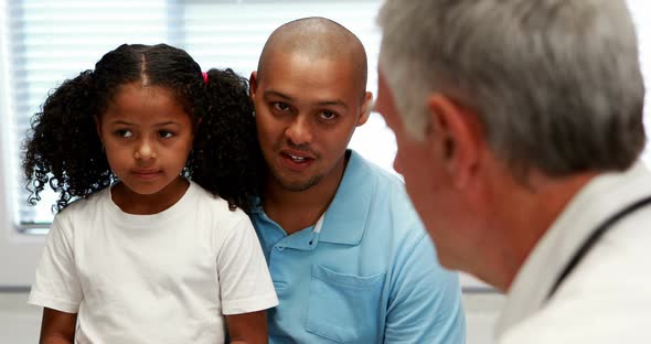 Male doctor and patient interacting with each other