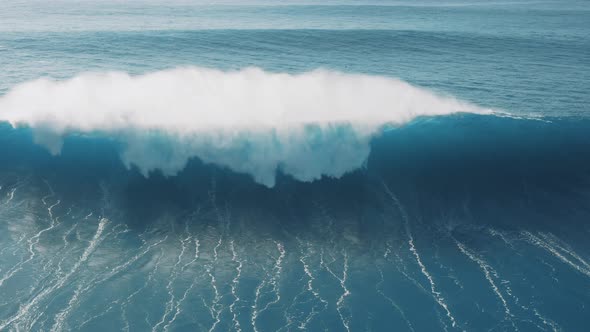 Breaking waves; blue water, thick seafoam, natural abstract pattern, sea texture