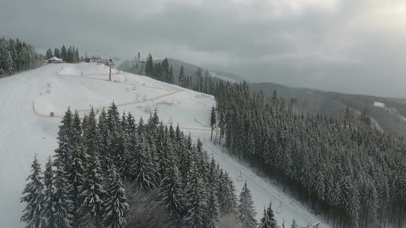 Snowboarders Go Down the Slope