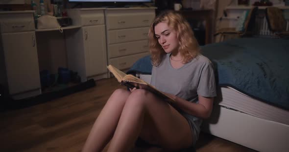 Sexy Woman with Naked Legs Reading Book