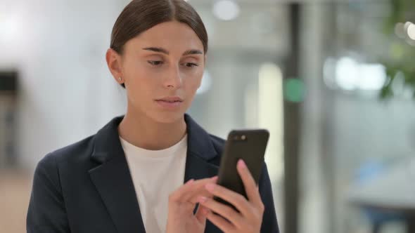 Portrait of Businesswoman Using Smartphone