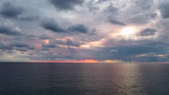 Cloudy Sunset Over the Sea Aerial View 4 K