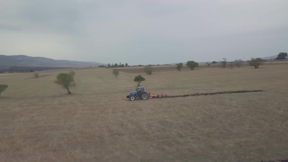 Agriculture Fly Around The Tractor Aerial drone shot