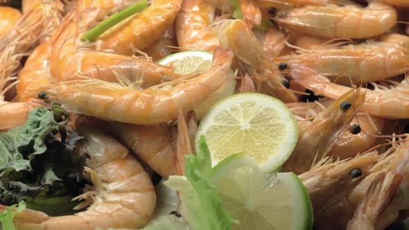 A Closeup of Cooked Shrimps Decorated with Lemon and Lettuce