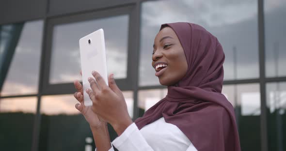 Black Woman in Hijab Have Video Call Outdoors