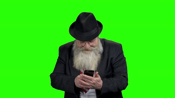 Senior Bearded Man Taking Photo with Phone