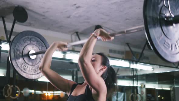 Strong Young Woman Lifting Heavy Weights at Gym Slow Motion