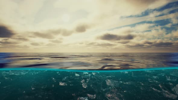 Split View Over and Under Water in the Caribbean Sea with Clouds