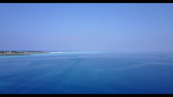 Aerial above sky of marine seashore beach voyage by blue sea and clean sandy background of a dayout 