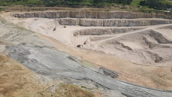 the Flight of the Drone Over a Quarry of Sand and White Stone