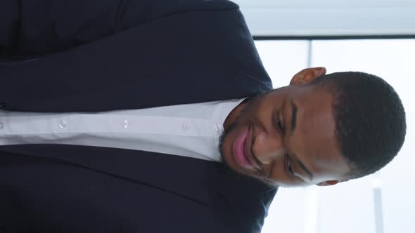 Vertical Screen Black Boss Talking to Diverse Staff at Meeting