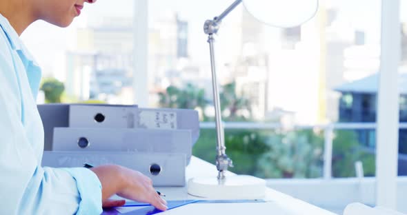 Woman drawing design at desk