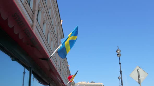 The Small Swedish Flag is Fluttering in the Wind