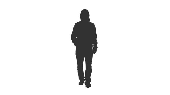 Silhouette of Hooded Man Walking on Street