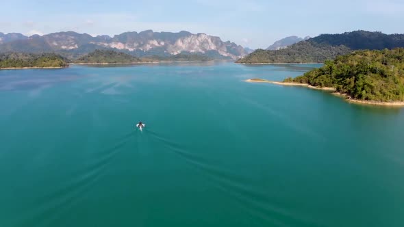 Drone flying straight over Rajjaprabha Dam or Cheow Lan Dam in Ban Cheow Lan, Surat Thani, Thailand