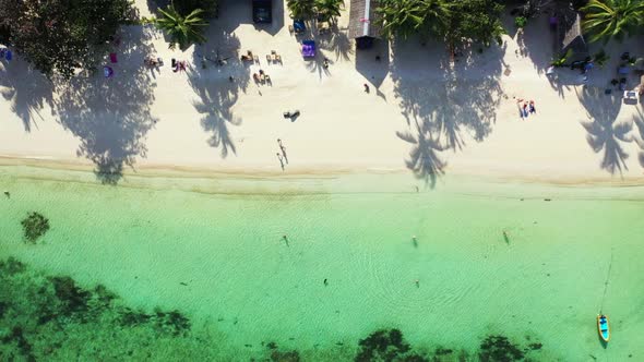 Aerial drone view panorama of exotic seashore beach holiday by blue sea with clean sand background o