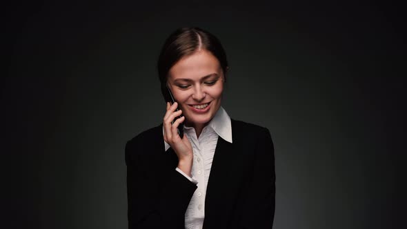 Attractive Brunette Business Woman Talking on Phone and Smiling