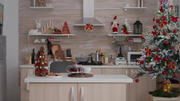 Empty Xmas Decorated Kitchen with Nobody in It is Ready for Christmas Morning Dessert